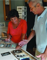 chris-jan-capece Chris and Jan Capece building a sign and selecting photos