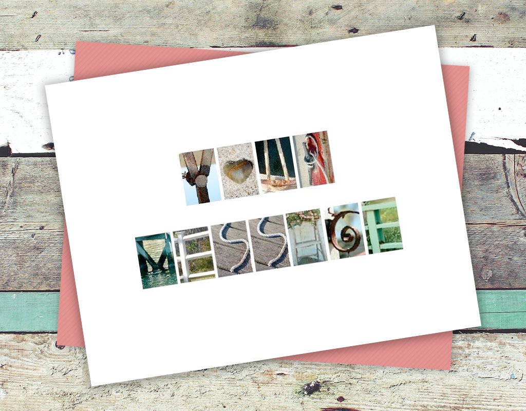 A custom greeting card displaying "YOUR MESSAGE" in nautical letters laying on a boardwalk painted in funky colors